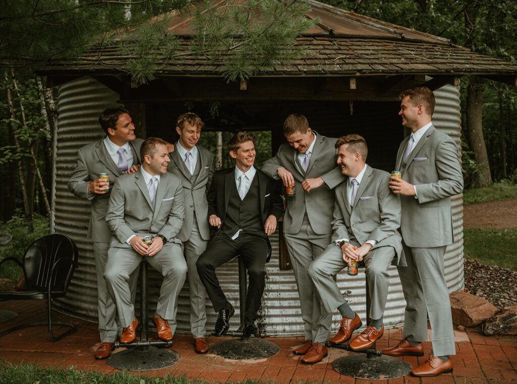 groomsmen and the groom having a good time at the groom shack at dixons apple orchard 