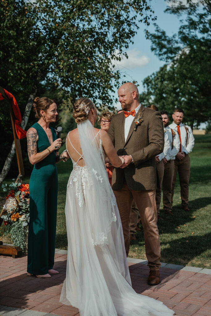 a view of the groom during his wedding ceremony