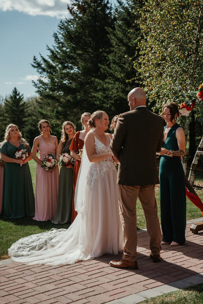 the bride laughing during her wedding ceremony