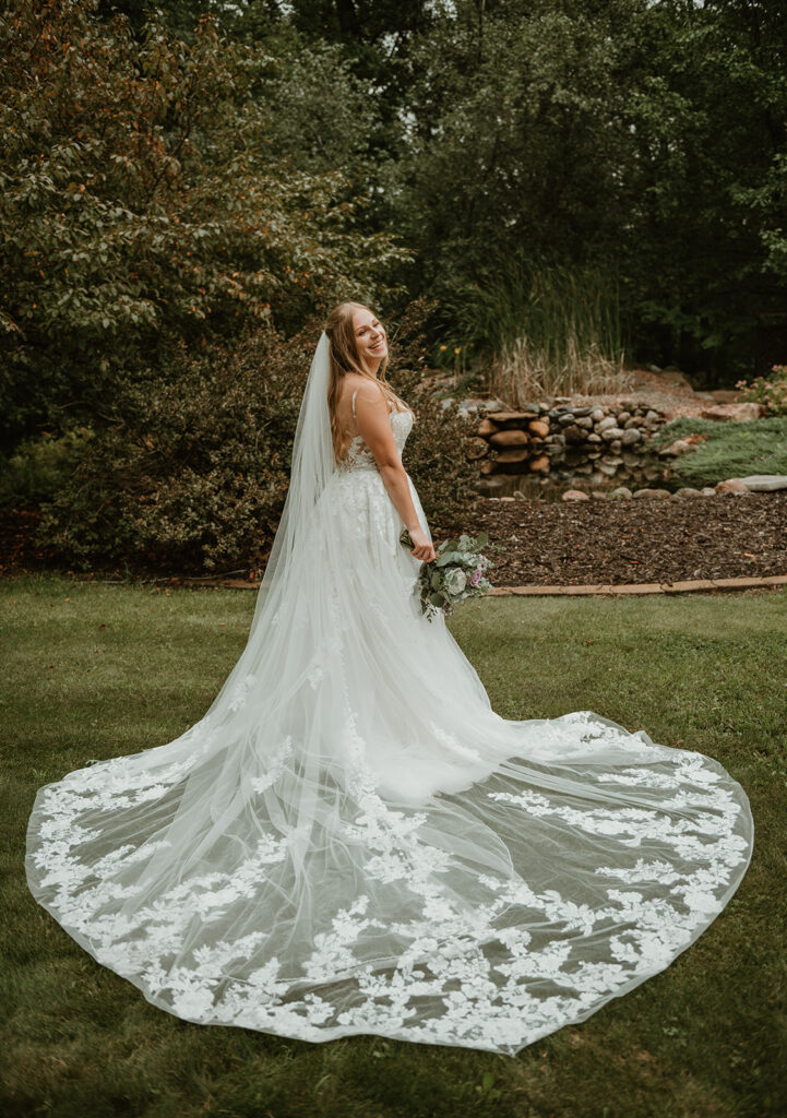 a bride smiling in her wedding dress