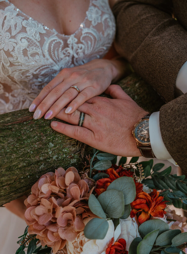 a newlyweds hands on their wedding day