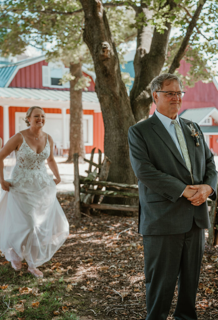 the bride walking up to her dad during their first look