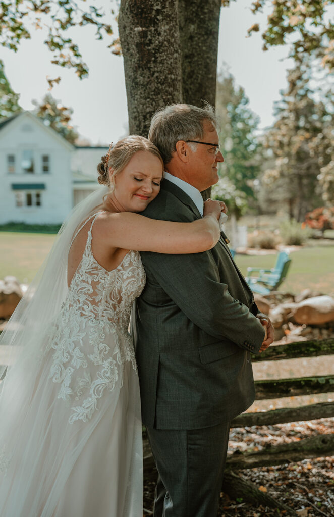 a bride hugging her dad on her wedding day