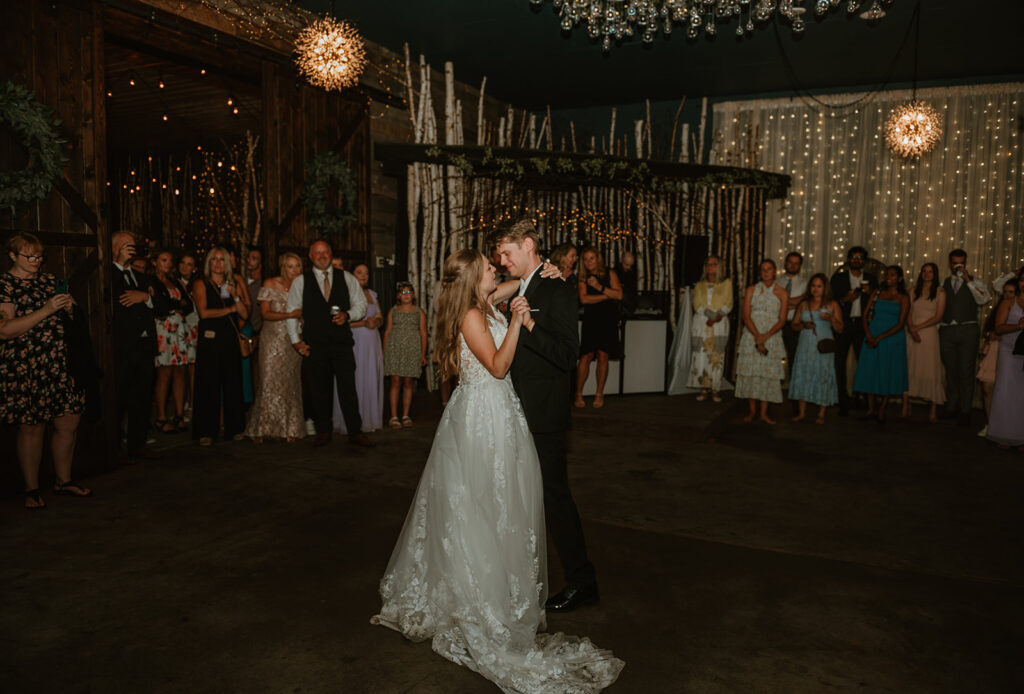 bride and groom having their first dance at dixons apple orchard