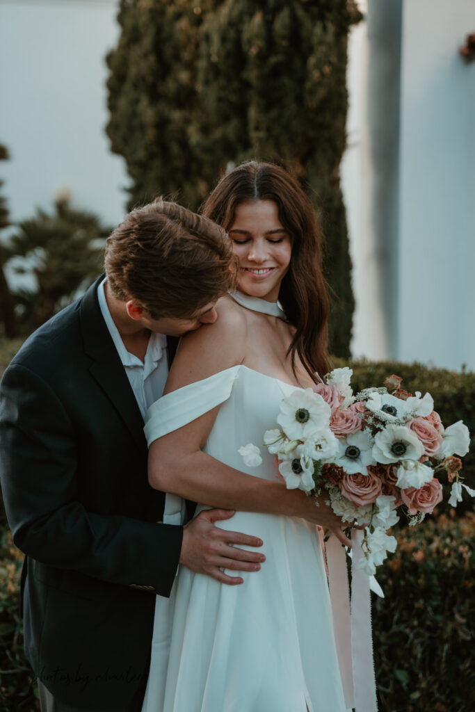 Intimate elopement photos in the gardens of Liberty Station, San Diego