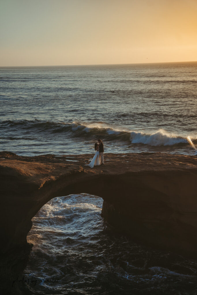 Looking down into the mysterious interior of a Sunset Cliffs sea cave from a designated viewpoint, showcasing natural rock formations